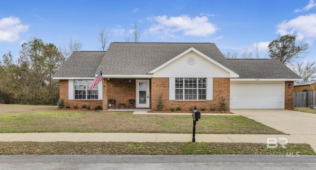 single story home with a garage and a front lawn