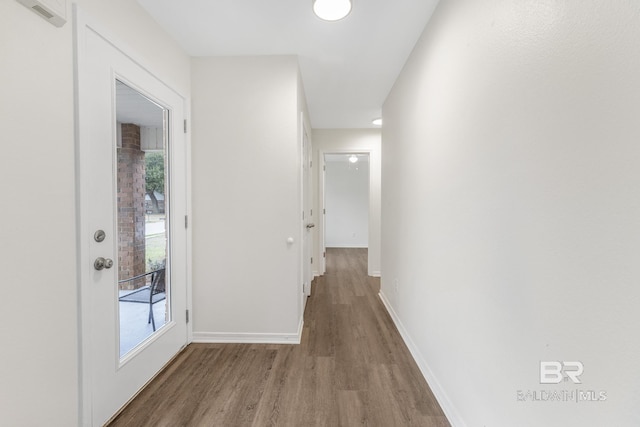 corridor with light wood-type flooring