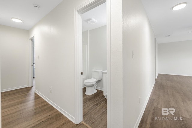 hallway featuring hardwood / wood-style floors