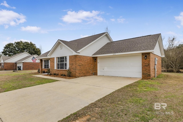 single story home with a garage and a front lawn