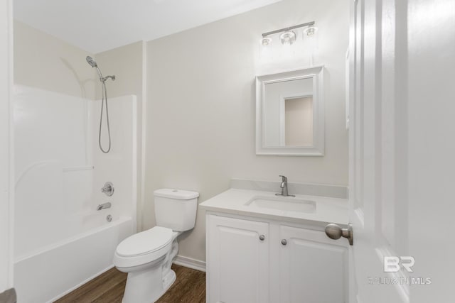 full bathroom with bathtub / shower combination, vanity, toilet, and hardwood / wood-style floors