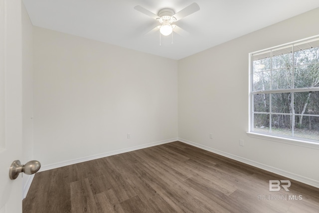 empty room with hardwood / wood-style floors, a wealth of natural light, and ceiling fan