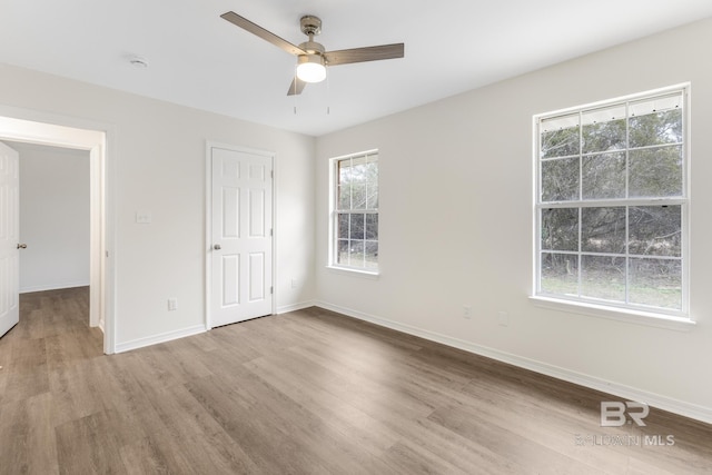 unfurnished bedroom featuring ceiling fan and light wood-type flooring