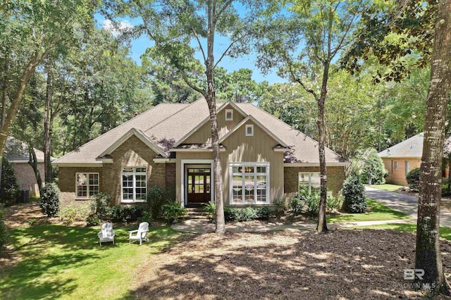 view of front of property with a front lawn and french doors