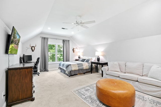 bedroom with ceiling fan, light carpet, and vaulted ceiling