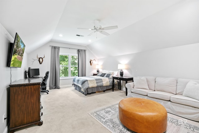 carpeted bedroom with vaulted ceiling and ceiling fan