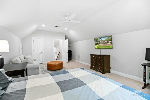 bedroom with light carpet, vaulted ceiling, and ceiling fan