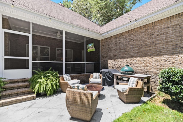 view of patio / terrace featuring a grill, a sunroom, and outdoor lounge area