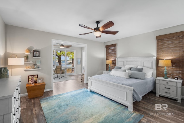 bedroom with ceiling fan and dark hardwood / wood-style flooring