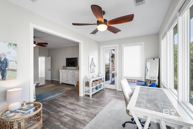 office space featuring ceiling fan, dark hardwood / wood-style floors, and a healthy amount of sunlight