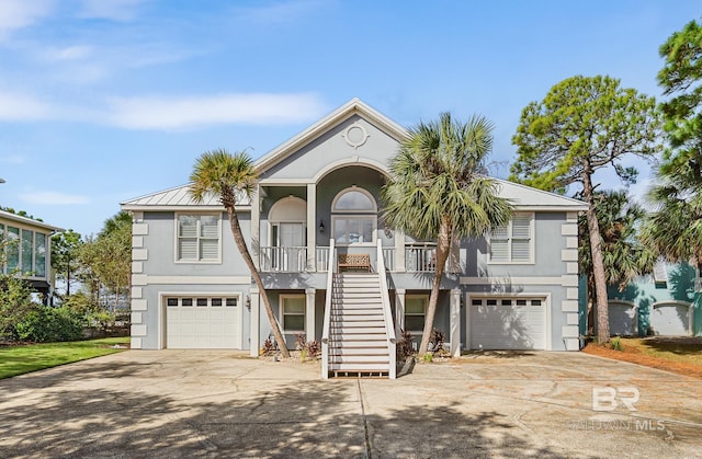 view of front of house with a garage and covered porch