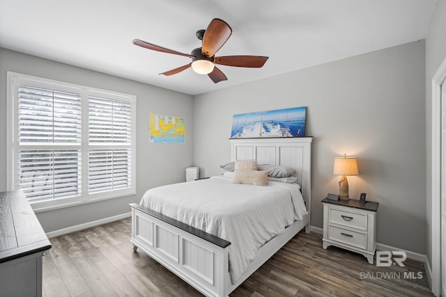 bedroom featuring dark hardwood / wood-style flooring and ceiling fan