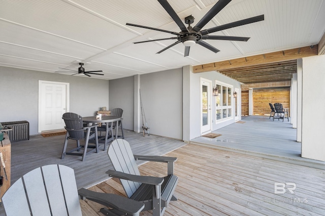 wooden deck featuring ceiling fan and french doors