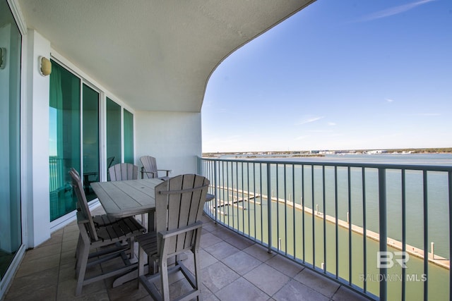 balcony featuring a water view