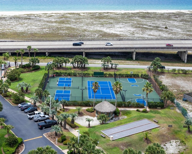 birds eye view of property with a beach view and a water view