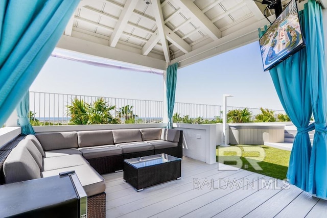 deck featuring an outdoor living space and fence