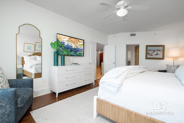 bedroom featuring connected bathroom, visible vents, dark wood finished floors, and a ceiling fan