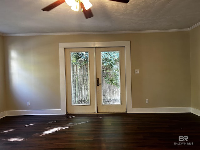 doorway featuring french doors, crown molding, ceiling fan, and dark wood-type flooring