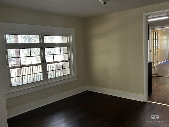 unfurnished room featuring dark hardwood / wood-style floors