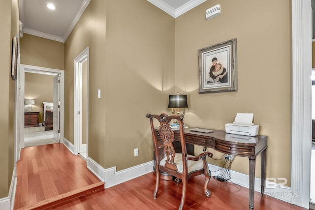 office area featuring crown molding and light hardwood / wood-style floors