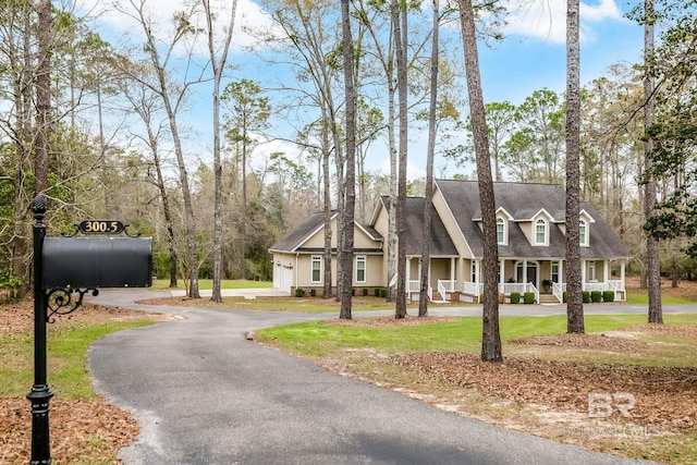 view of front of house with a front lawn and a porch