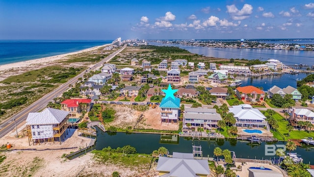 bird's eye view featuring a residential view and a water view