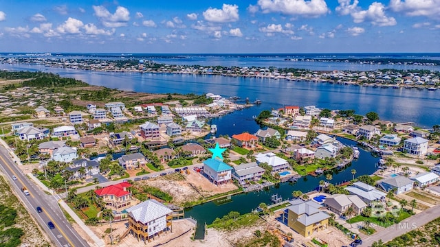 birds eye view of property with a residential view and a water view