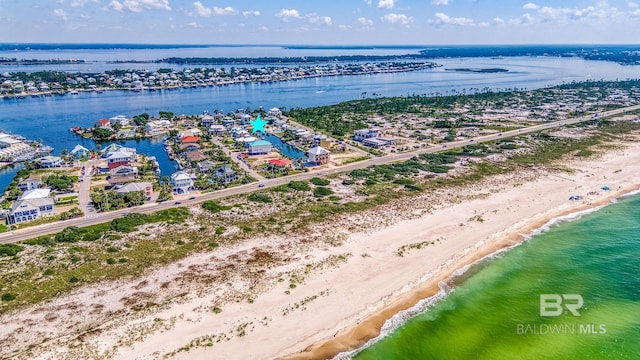 bird's eye view with a view of the beach and a water view