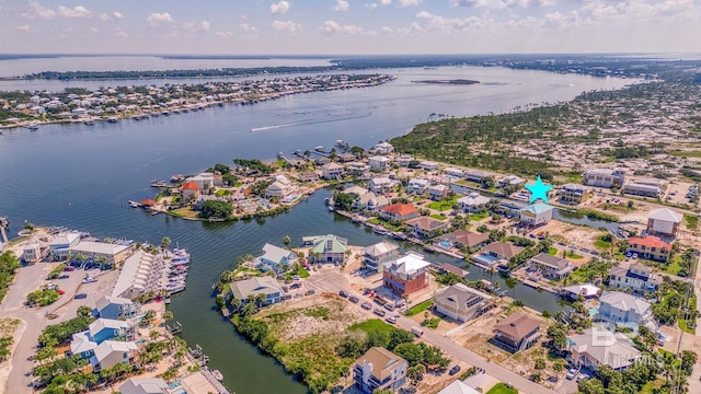 bird's eye view featuring a water view and a residential view