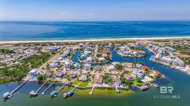 birds eye view of property with a water view and a residential view
