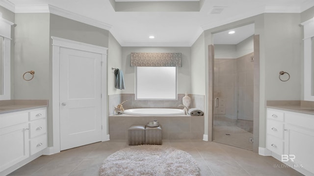 bathroom with tile patterned floors, a bath, a shower stall, and vanity