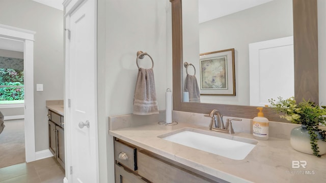 bathroom with tile patterned flooring and vanity