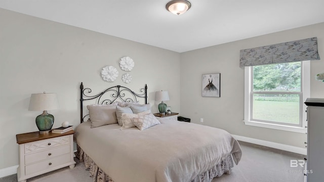 carpeted bedroom with baseboards