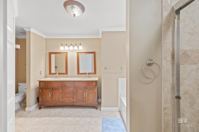 bathroom with toilet, vanity, tile patterned flooring, and ornamental molding