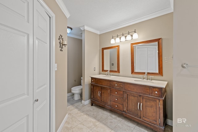 bathroom with toilet, a textured ceiling, tile patterned flooring, crown molding, and vanity