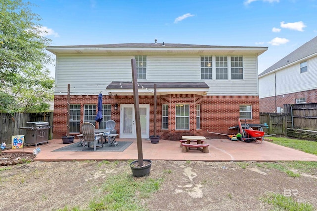 rear view of property featuring a patio