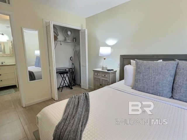 bedroom featuring a closet and light hardwood / wood-style floors