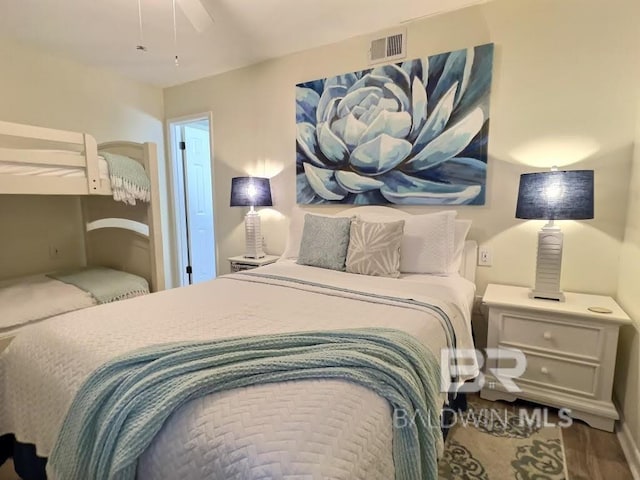 bedroom with hardwood / wood-style floors and ceiling fan