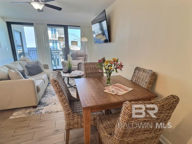 dining room featuring ceiling fan and light hardwood / wood-style floors