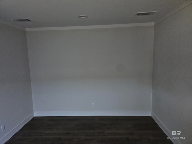 unfurnished room with dark wood-type flooring