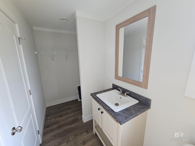 bathroom with hardwood / wood-style flooring and vanity