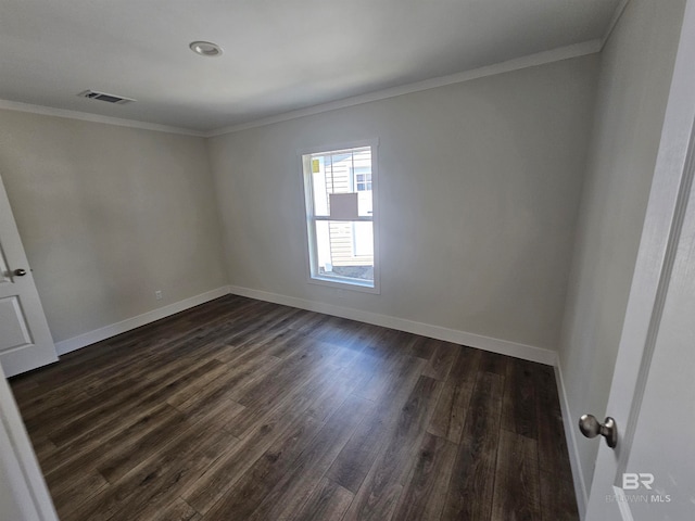 unfurnished room with hardwood / wood-style flooring and crown molding