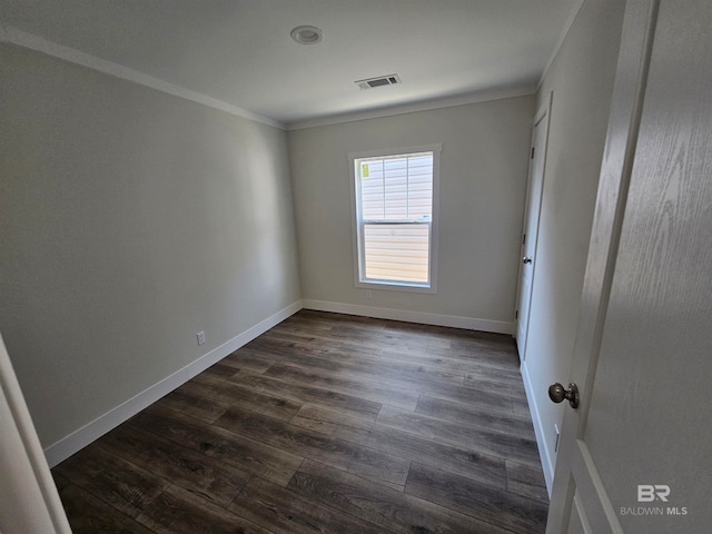 unfurnished room featuring wood-type flooring and ornamental molding