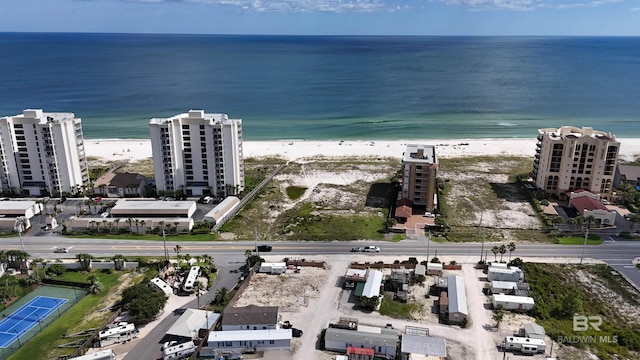 bird's eye view featuring a view of the beach and a water view