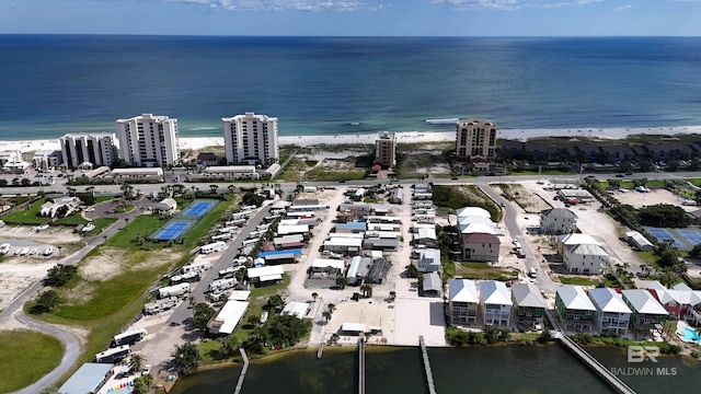 birds eye view of property with a view of the beach and a water view