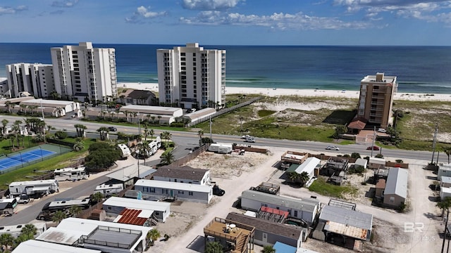 drone / aerial view with a water view and a view of the beach