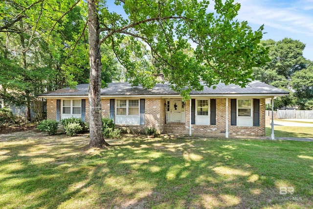 ranch-style home with covered porch and a front lawn