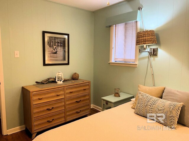 106 Ryan Ct, Dauphin Island, AL 36528 - bedroom featuring dark wood-style flooring, baseboards, and ornamental molding