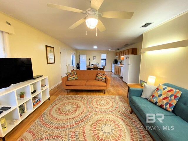 106 Ryan Ct, Dauphin Island, AL 36528 - living room featuring light wood-type flooring, ceiling fan, and baseboards