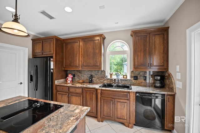 kitchen featuring black appliances, a sink, tasteful backsplash, crown molding, and pendant lighting